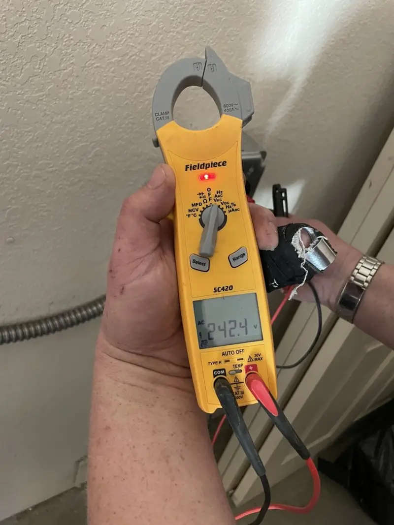 Voltage testing with clamp meter during Ceiling Fan Installation in Vincent